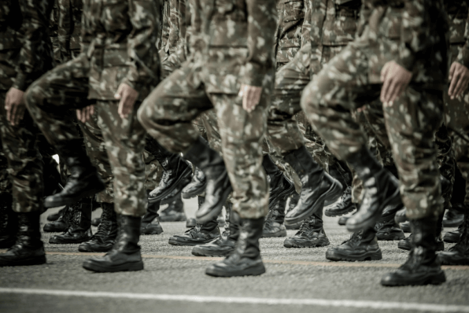 Soldiers marching in military fatigues